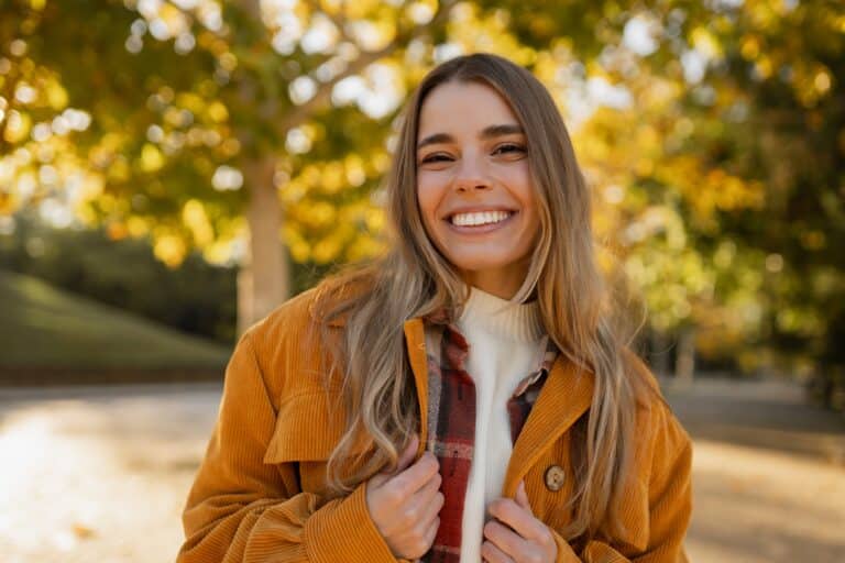 Young,Beautiful,Blond,Woman,Walking,In,Autumn,Park,,Stylish,,